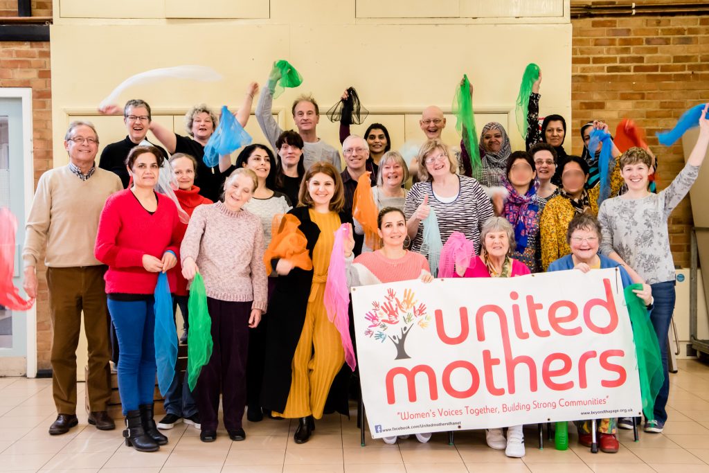 United mothers cheering and holding banner